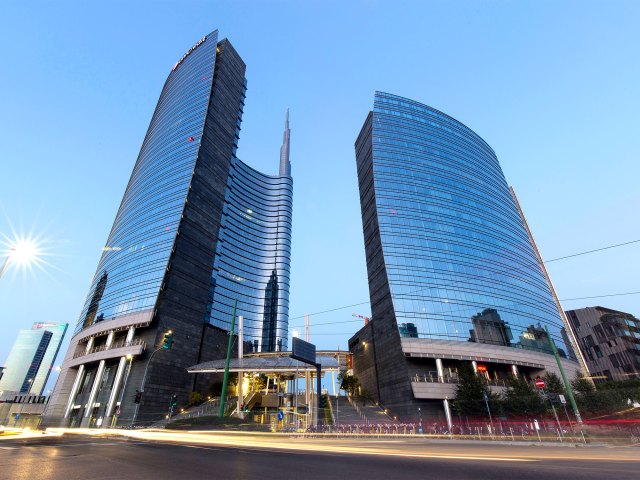 Glass facade of the Unicredit Tower in Milan, Italy