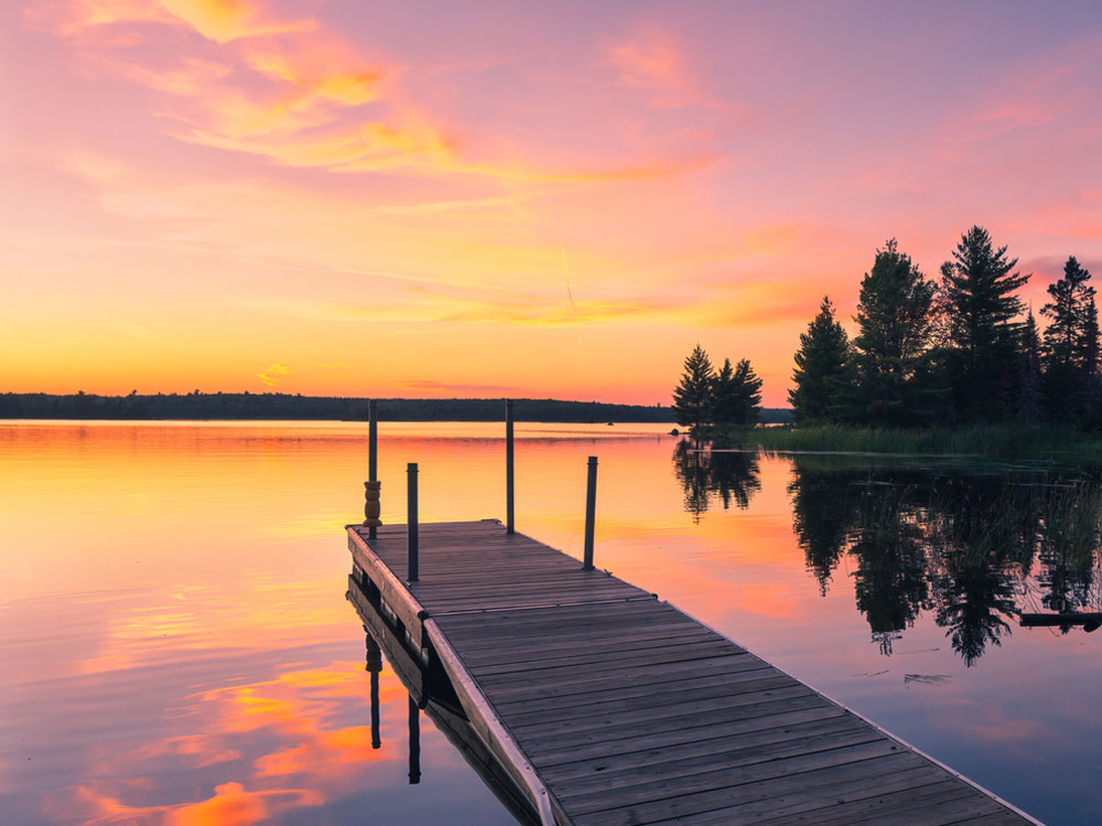 Empty dock and sunset over Lake Michigan