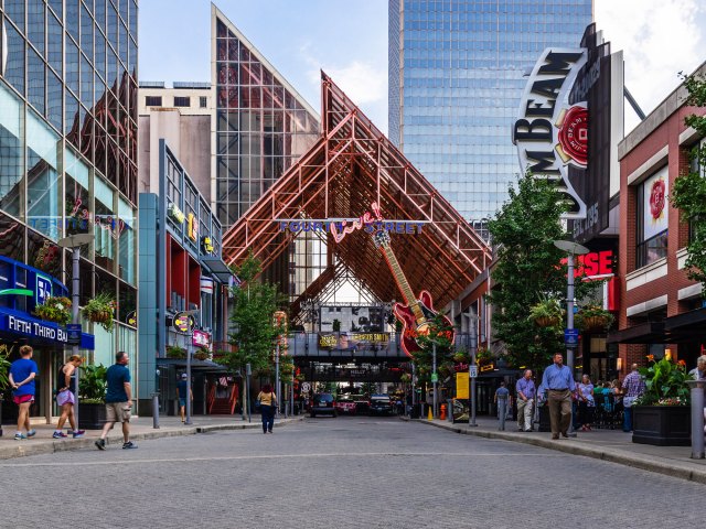 A picture of downtownLouisville, featuring several restaurants and a pedestrian area