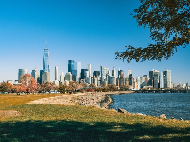 A distant view of the Jersey City skyline along the shoreline