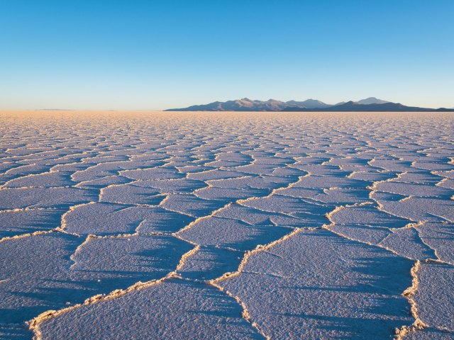 View of Salar de Uyuni salt flat in Bolivia stretching as far as the eye can see