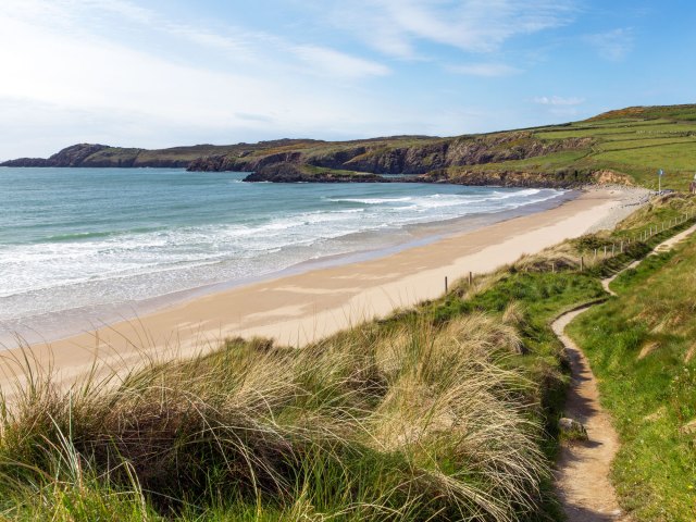 Pembrokeshire Coast Path along sandy beach in England, seen from above