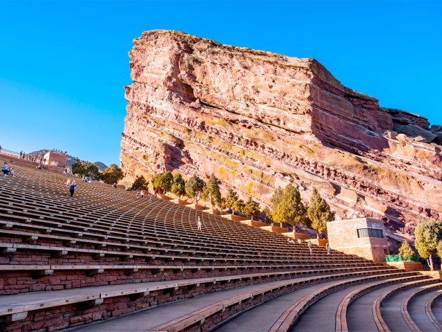 Stands at Red Rocks Amphitheatre in Morrison, Colorado, framed by red rock formations