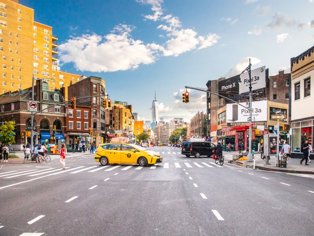 Yellow taxi crossing street in New York City