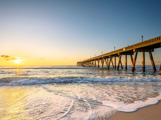 Pier off the coast of Wilmington, North Carolina, at sunset