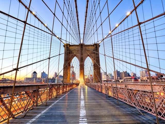 View of Brooklyn Bridge pedestrian path at dusk