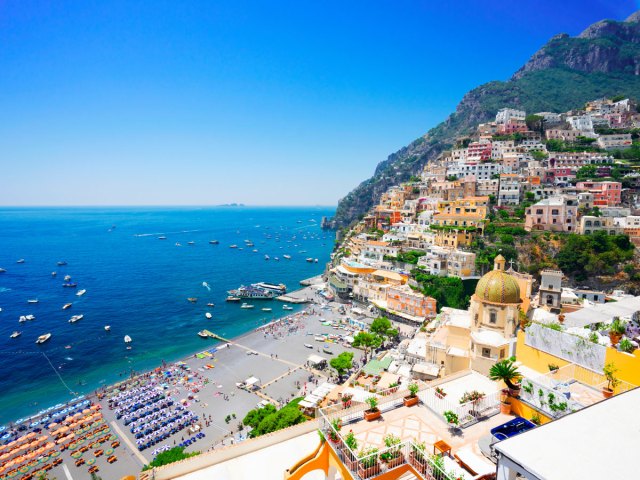 Colorful homes stacked on hillside overlooking the Amalfi Coast in Italy