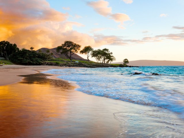 Sunset over sandy beach on Maui