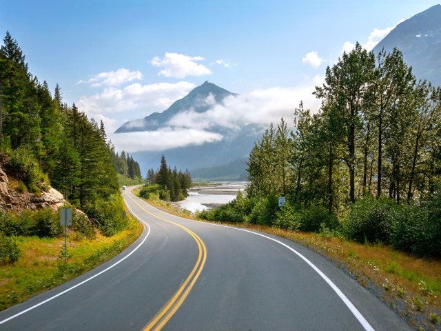 Seward Highway winding through mountains and forest in Alaska