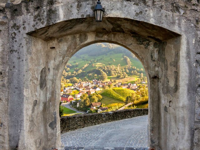 Countryside view through the stone window in Balzers, Liechtenstein