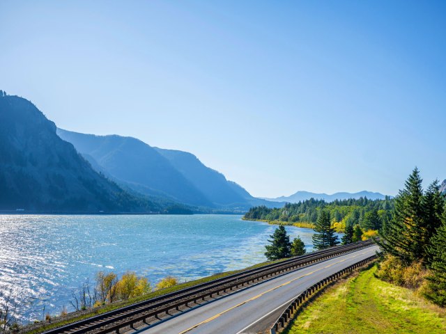 Railroad track and two-lane highway next to the Columbia River