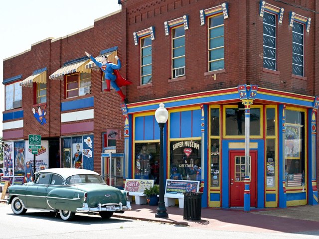 Statue of Superman hanging from the side of the Super Museum in Metropolis, Illinois