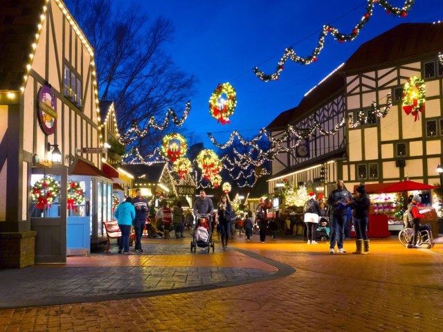 People strolling through downtown Williamsburg, Virginia, decorated for the holidays