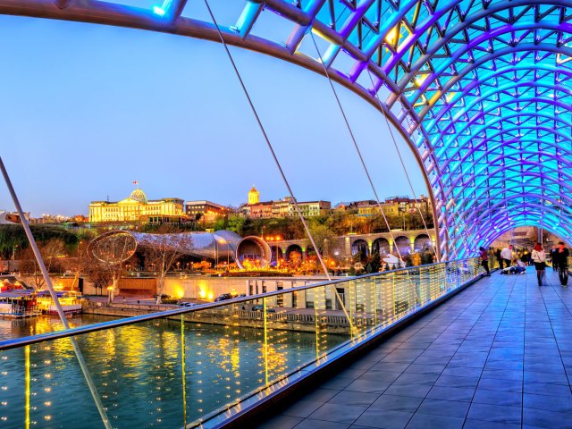 The Peace Bridge over river in Tbilisi, Georgia, seen at night