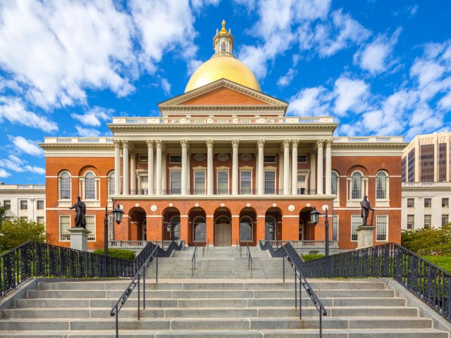 Red-brick Massachusetts State House topped by gold dome