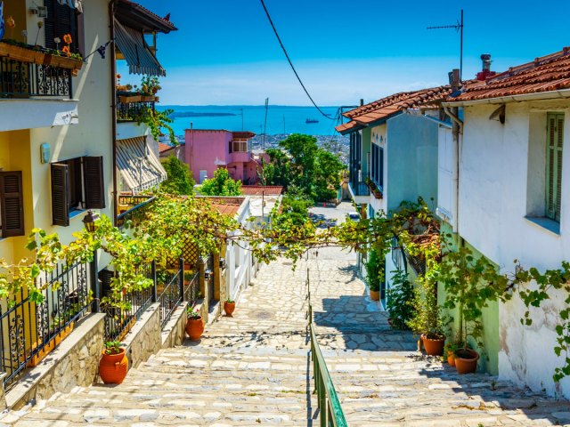 Staircase between homes overlooking the sea in Thessaloniki, Greece