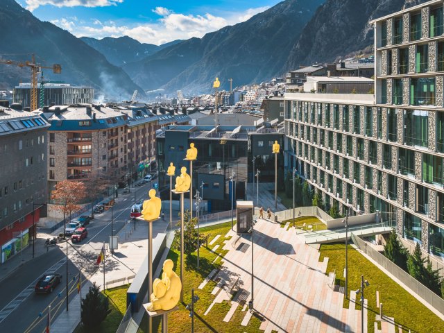 Buildings tucked in mountain valley in Andorra, seen from above