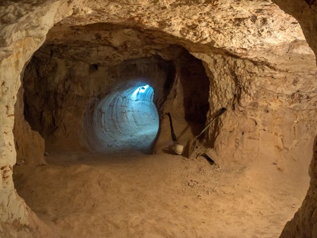 Winding rock tunnel in Coober Pedy, Australia