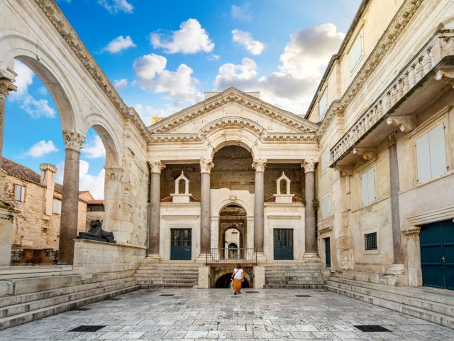 Person standing inside open-air room at Diocletian's Palace in Split, Croatia