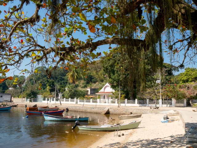 Boats docked on sandy beach on Paquetá Island in Brazil