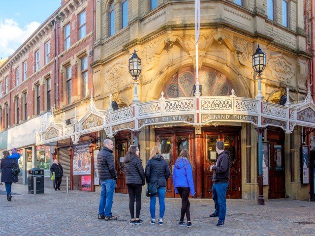 Onlookers outside the historic Grand Theatre in Blackpool, England