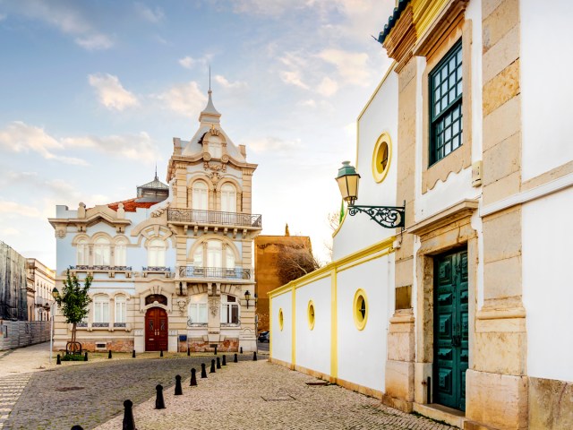 Church and cobblestone streets in Faro, Portugal