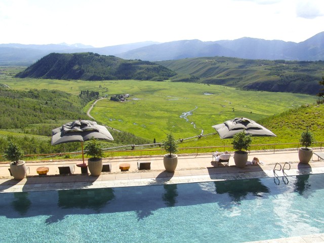 Aerial view of pool overlooking mountains at Amangiri resort in Wyoming