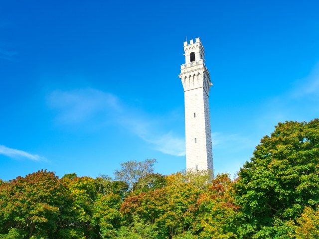 Pilgrim Monument standing above trees in Provincetown, Massachusetts