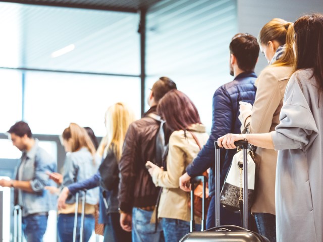 Travelers in line at airport