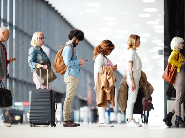 Passengers waiting in line at airport