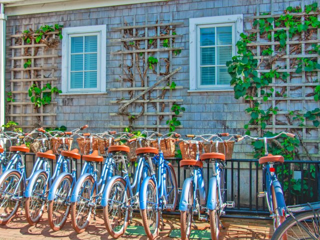 Rack of bikes in front of hotel