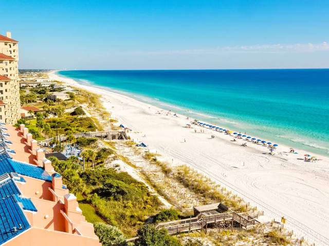 View of sandy Florida beach from hotel balcony