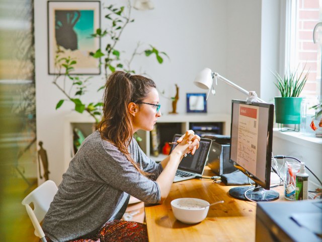 Person working at desk on computer