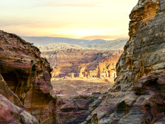 View between steep rock cliffs of Petra, Jordan, in the distance