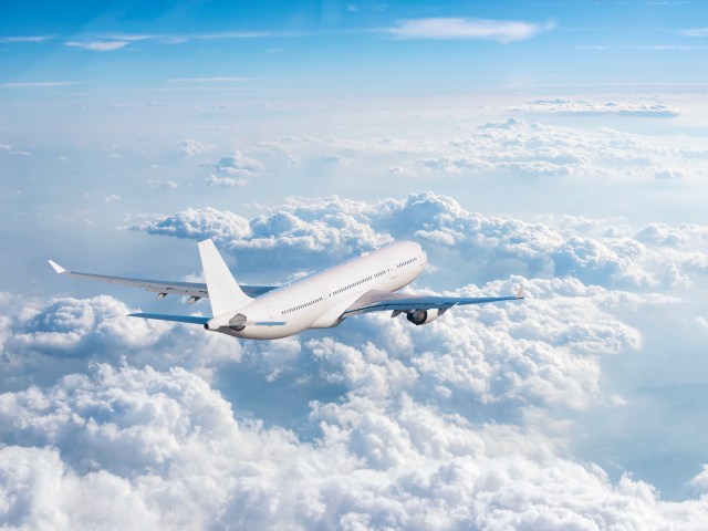 Aircraft cruising above clouds