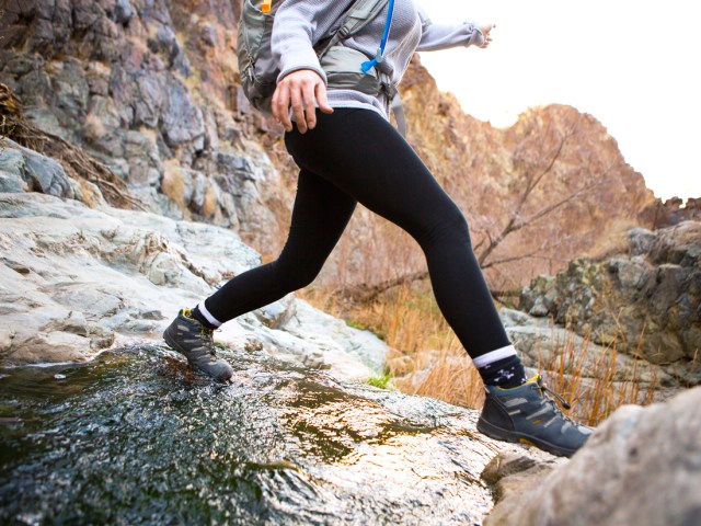 Person hiking with sneakers