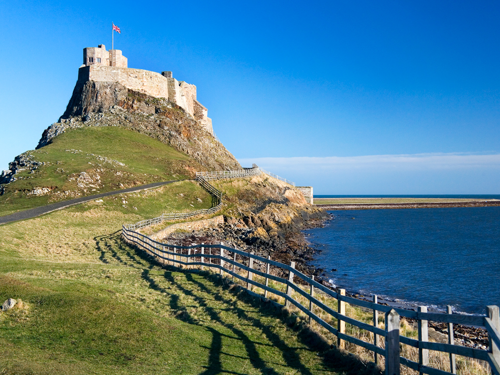 Pathway leading to hilltop fortress on Holy Island of Lindisfarne in England