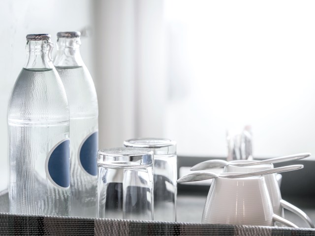 Water jug and glasses in hotel room