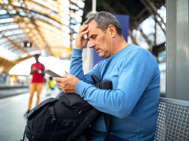 Traveler sitting in train station