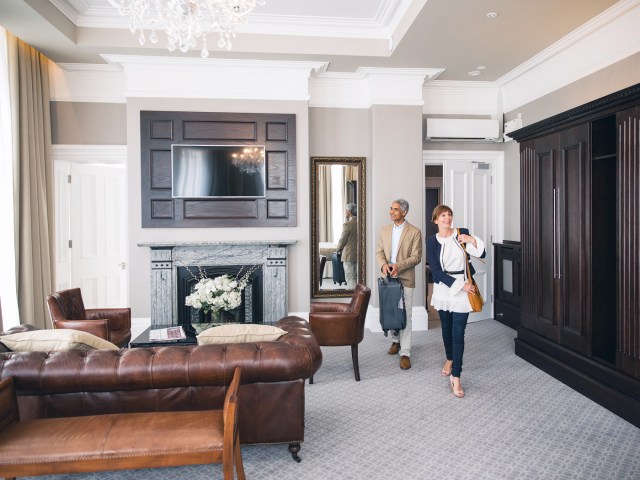 Couple entering large hotel suite