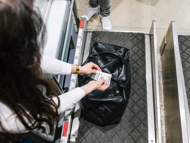 Airport agent tagging baggage