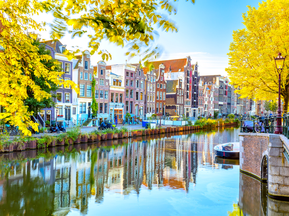 Row homes along canal in Amsterdam, The Netherlands