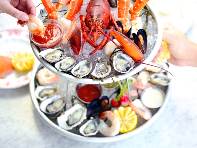 Diners enjoying a seafood tower