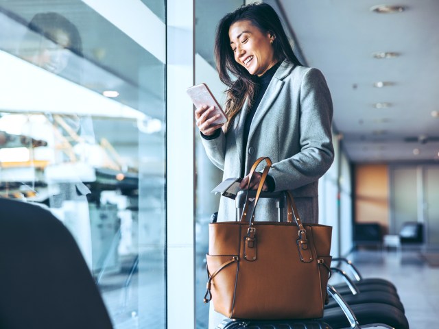 Traveler at airport with tote bag