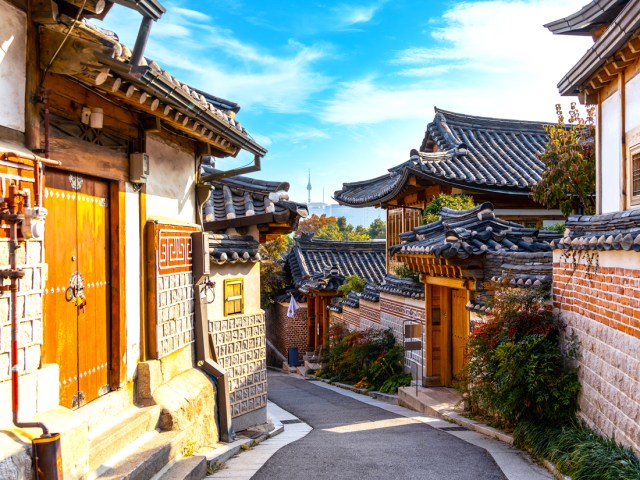 Narrow winding lane between traditional homes in Bukchon Hanok Village in Seoul, South Korea