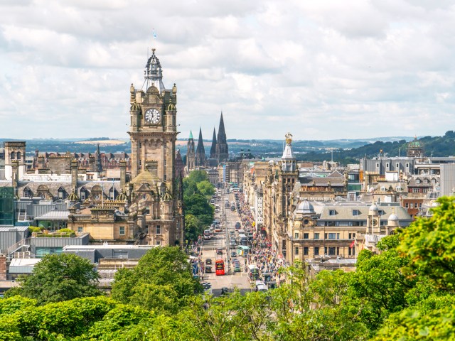 Clock tower above skyline of Edinburgh, Scotland