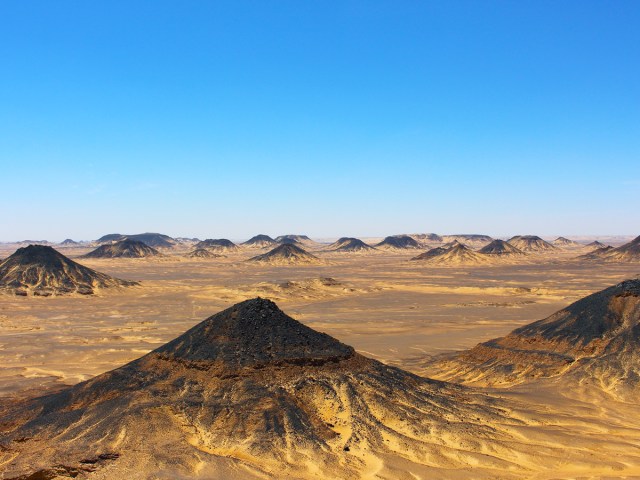 Hills covered in black sands in Egypt's Black Desert