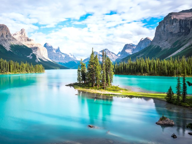 Glacial lake surrounded by Rocky Mountains in Jasper National Park of Alberta, Canada