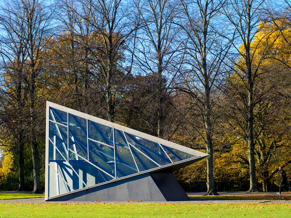 Glass pyramid in mark that serves as entrance to underground Cisternerne in Copenhagen, Denmark