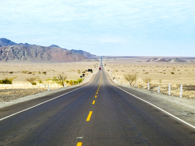 Empty two-lane stretch of the Pan-American Highway through desert of Peru